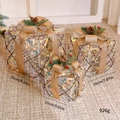 Beige Christmas plush gift boxes set of 3 with gold bows and pine cone decorations - Iridescent Colorful Gift Boxes 3Pcs