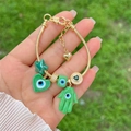 18K gold plated snake chain bracelet with green evil eye and Hamsa hand charms - White