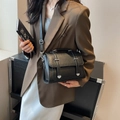 Minimalist black textured leather crossbody bag with top handle and silver hardware - Black