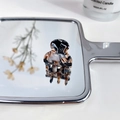 Mini acetate hair claw clip with tortoise shell pattern on a decorative mirror - Marble