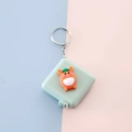 Mini carrot tape measure keychain in light green plastic shell with portable ring - Carrot