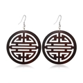 Macro detail of dark brown round hollow wooden earrings with traditional pattern - Style 48