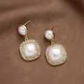 Detailed macro of vintage pearl drop earrings with rhinestones on brown silk - Gold Pearl Earrings (S925 Silver Needle)
