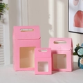 Detailed view of three pink gift boxes with clear window and handles in small medium and large - 15*10*6cm / Pink