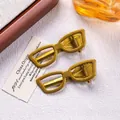 Close-up of gold sunglasses hair clips showing 2.1x5.8cm size and 4g weight details - Gold