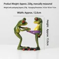 Funny green frog resin figurines showing one frog pulling another's purple underwear - Funny Underwear Pulling Frog