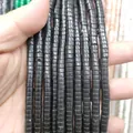 Close-up of polished black natural stone cylindrical spacer beads for DIY jewelry making - Black Stone