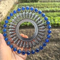 Macro shot of silver boho wall decor featuring blue crystal inlay and intricate metalwork - Retro Silver Royal Blue Rhinestone