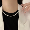 Elegant 925 sterling silver pearl necklace with round white pearls on a female model - Full Pearl Strand Elegant Chain (xl1166-2)