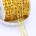 Close-up of 18K gold-plated brass H-link anchor chain on a white plastic spool for DIY - Bar Chain / 18K Gold Plated