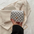 White mini PU leather chain bag featuring black four-leaf clover patterns and gold buckle - Clover White