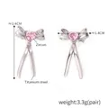 Silver bow stud earrings with pink heart zircon in 18K gold plated titanium steel - Steel Pink Zircon Bow (F1474)