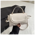 Detail of white PU leather crossbody bag with U-shaped stitching and gold hardware - White