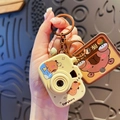 Beige Capybara cartoon camera keychain with brown metal ring and decorative charm - Capybara Cartoon Camera-Style B