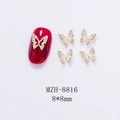 Close-up of golden hollow butterfly nail art charms with white rhinestones, size 8x8mm - Gold Butterfly With Rhinestone (8816)