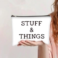 White canvas makeup bag with black STUFF & THINGS print and secure top zipper closure - Stuff and Things Organizer Style (jiayingpbb0285)