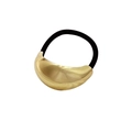 Close-up of a large gold polished alloy crescent decoration on a black hair tie - Smooth Yuanbao