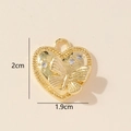 Macro shot of 2cm golden heart pendant with embossed butterfly and clear crystals - 0228-20/Gold Butterfly Heart