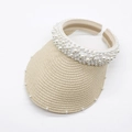 Detail of straw woven sun hat with elegant pearl embellishments and headband design - Beige