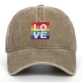 Detailed view of LOVE rainbow embroidery on vintage washed cotton baseball cap texture - One Size / Khaki