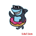 Detailed view of shark embroidery patch with sunglasses and pink donut, size 5.8x7.3cm - Blue Shark Donut