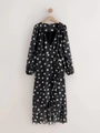 Abito a portafoglio francese nero con pois bianchi e maniche lunghe a lanterna - S / Nero