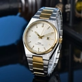 Detail of silver grid dial with gold hands and date window on steel luxury watch - 12-Two-tone White Dial