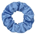 Detailed view of glossy blue satin fabric texture and pleated design on a hair scrunchie - Haze Blue