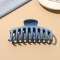 Detail of a matte blue hair claw clip with ten teeth on a beige aesthetic background - Light Blue Matte-Keel