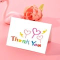 White folding thank you card with hand-drawn lettering and pink hearts on pink background - S604-8 Thank You Pink Hearts