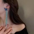 Detail of blue gradient butterfly earrings with long flowing tassels on a model - Butterfly Long Tassel (5#)