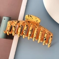 Detail view of large orange and black ink-splashed claw clip on a stylish table setting - 11cm Large Size / Glossy Yellow Splash Ink 11cm