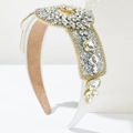 Detail of luxury padded headband with white satin, amber centerpiece and sparkling crystals - White
