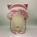 Close-up of pink and beige knit cat ear hat with faux fur trim and braided tassels - Rose Pink and White Braid