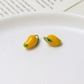 DIY jewelry yellow mango pendants with green leaves and metal loops on a white plate - 10#Mango (7*13mm)