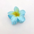 Macro detail of a light blue plumeria hair claw clip with a yellow center gradient finish - Blue