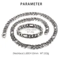 Macro shot of retro flat Cuban chain links showing intricate tribal patterns and textures - Silver Jewelry Set