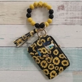 Detail of silicone bead bracelet, sunflower floral card holder, and tassel keychain set - Sunflower