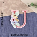 Embroidered letter U patch with colorful flowers and green leaves for apparel decor - Letter U / Hot Melt Adhesive