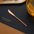 Copper-colored 304 stainless steel butter knife on a minimalist placemat for dessert - Dinner Knife / 150mm / Rose Gold