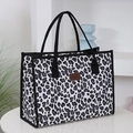 Large capacity tote bag featuring black and white leopard print and woven handles - White Large