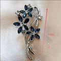 Detail view of flower brooch with blue marquise crystals and dimensions of 6.4cm - Blue