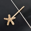 Detailed close-up of a golden starfish hair clip featuring realistic marine textures - Single Starfish Bobby Pin / Gold