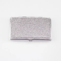 Top view of rectangular silver metal case with dense sparkling crystal rhinestones - White