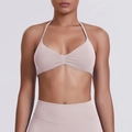 Detail of muted mauve seamless yoga set with halter sports bra and high waist leggings - XS / Porcelain Pink