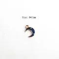 Close-up of a blue enamel moon charm with gold plating and stars, size 8x11mm for DIY - Small Moon - Blue