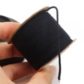 Close-up of 1.5mm black cotton cord on a spool held by hand for DIY jewelry making - Approx. 1.5MM / Black