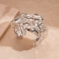 Detailed view of silver-tone crinkled texture on irregular wide geometric cuff bracelet - Silver
