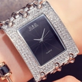 Close-up of sparkling rhinestone chain bracelet watch with a sleek black dial on wrist - Black Dial Silver Strap With Diamonds