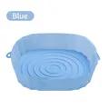 Blue circular silicone air fryer liner with wavy base and handles for easy lifting - Blue
